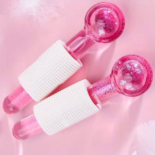 Pink Glitter Cryo Globes for soothing face massage and reducing inflammation after chilling in a skincare fridge.